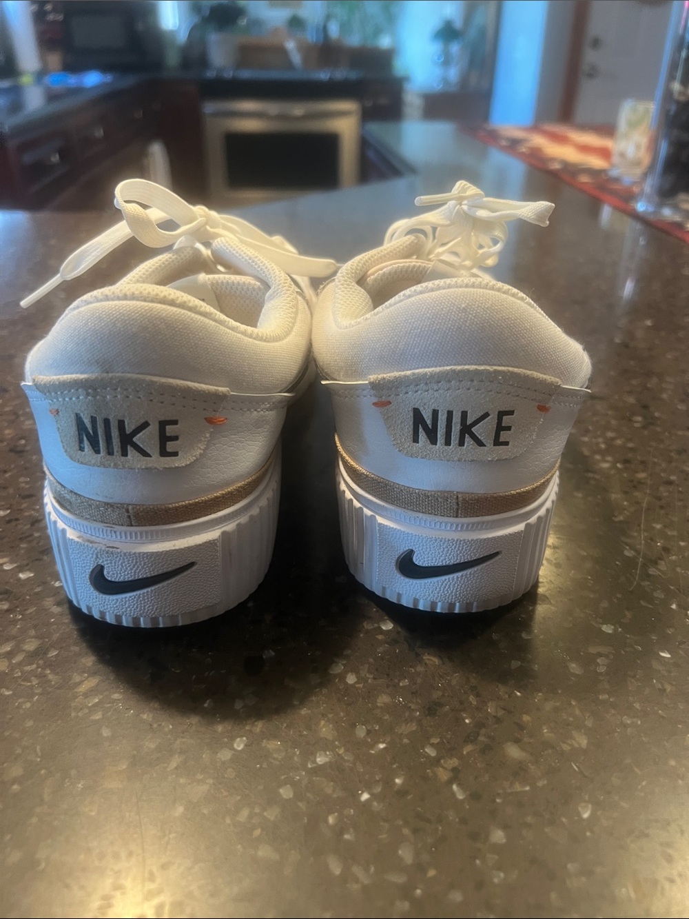 Nike White Sneakers with Black Swoosh and Subtle Tan Trim - Picture 2 of 4